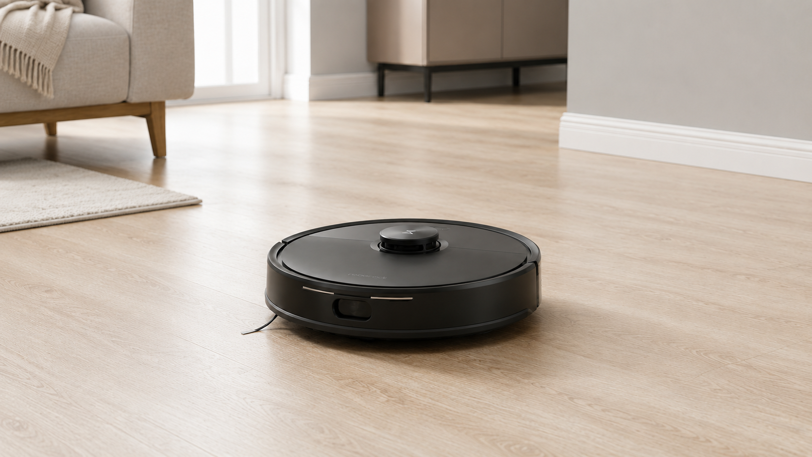 Roborock Q7 M5 robot vacuum on a wood floor in a bright living room